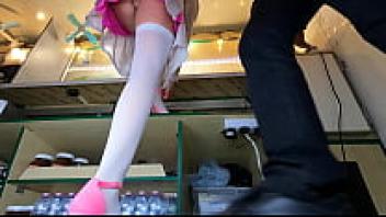 At work, a seductive brunette is testing on new shoes while exposing her upskirt.