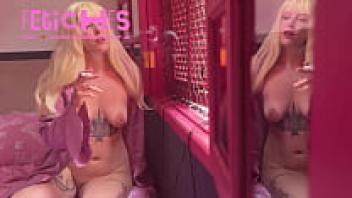 Smoking a cigarette while a hot blonde