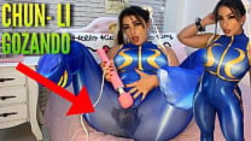 This sexy cosplay girl is dressed as Chun Li from Street Fighter, and she is playing with her Htachi vibrator, cumming, and wetting her pants and panties. Ahegao.