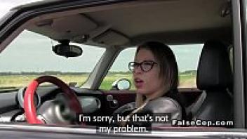 A tiny and busty lady with fake police bangs