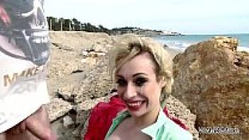 A wild love affair on the beach with a busty blonde who eats sperm
