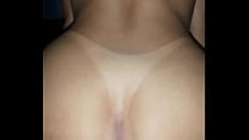 This young brunette is seated.