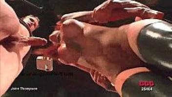 Redhead babe wearing latex boots.