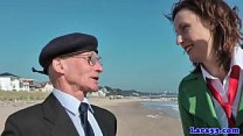 Three men spit roast stockinged mature