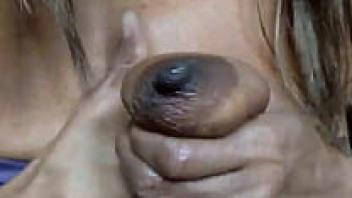 In this little video, Milky MILF Ginger MoistHer extracts milk from drooping tits.