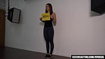 A lovely college student adores during a photo session.