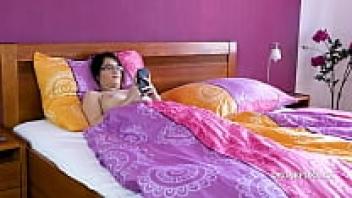 Casey, a Czech girl with petite tits, masturbating