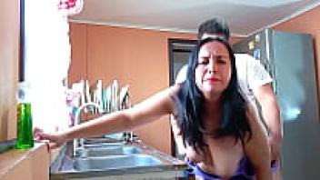 In the kitchen, topless, and groaning loudly, I'm loving my stepmother.