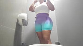 A pervert records females in the public restroom at the gym.