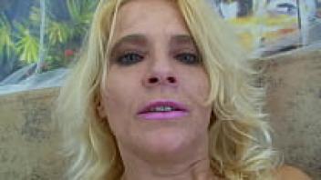 A gorgeous blonde cougar stuffs her hairy pussy.