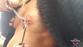 Extreme nipple straining and hook-adorned nipple piercings on a sexy mother