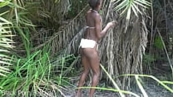 A thin woman from an African tribe working outside