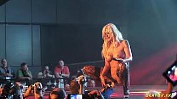 On stage, a busty German Milf lapdance