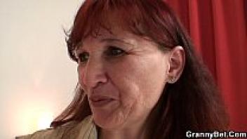 He drills into her aged, hairy pussy.