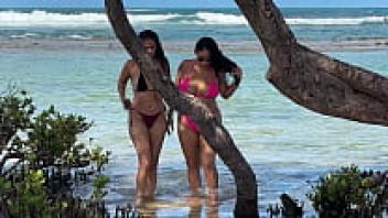 At Enseada dos Corais in Cabo, PE, two hotties are having fun on the beach.