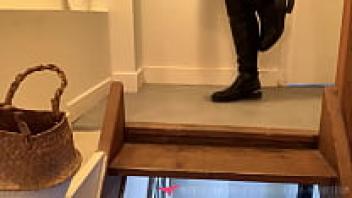 French dominatrix fetishism: boots, leather, hair, and foot