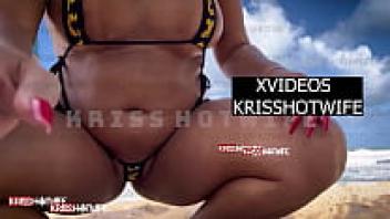 Because Kriss's hot wife wears a tiny bikini that leaves all the pussy out, men get hard on the beach.