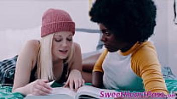 A cute white girl licks the little tits of a black muff diver.