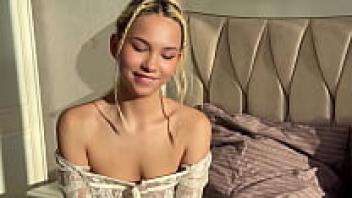 A slender 18-year-old beauty sits atop a large cock.