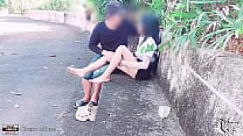 On display in the park, the student adores his girlfriend.