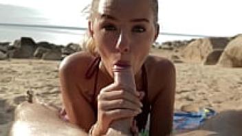 At the beach, a gorgeous blonde female gets an oral creampie while sucking my dick.