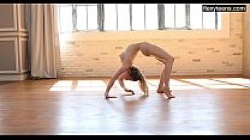 Emma Jomell, a stunning gymnast, demonstrates her flexibility.