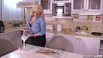 In the kitchen, busty Katy Jayne destroys a throbbing cock.