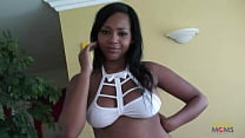 A ebony chick with big tits makes a white cock vanish in her shaved pussy.