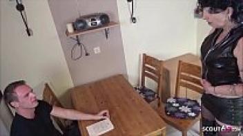 Naomi, a German mother, seduces her stepson in the kitchen.