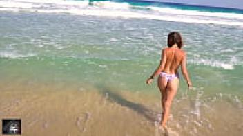 On the beach, the lifeguard bumps into me.