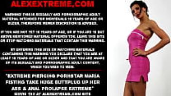 Extremely piercing pornstar Maria Fisting has severe anal prolapse and a large buttplug up her ass.