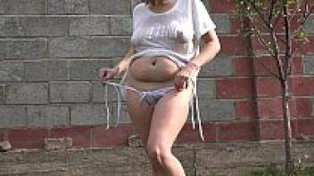 Big tits under a wet tank top and masturbation of a hairy pussy with a bottle. Amateur fetish and sexy butt Doggystyle outdoor.