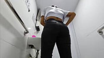 Big ass is captured by an amateur camera in a hospital restroom. A Latina nurse