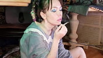 A young mother smokes cigarettes.