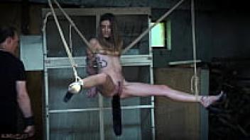 A skinny teen enjoys kinky, hard bondage.
