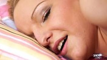 A curvaceous blonde adolescent waits for a man to cum on her