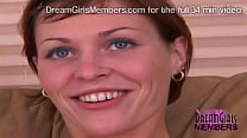 On the casting couch, a fiery redhead strips naked.