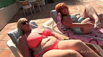 Melody and Melanie, two curvaceous, mature beauties, go naughty by the pool at Aunt JudysXXX.